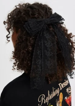 Haaraccessoires<The Sting Kanten haarclip met strik zwart