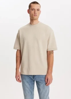 Basics|T-Shirts<The Sting Oversized t-shirt lichtzand
